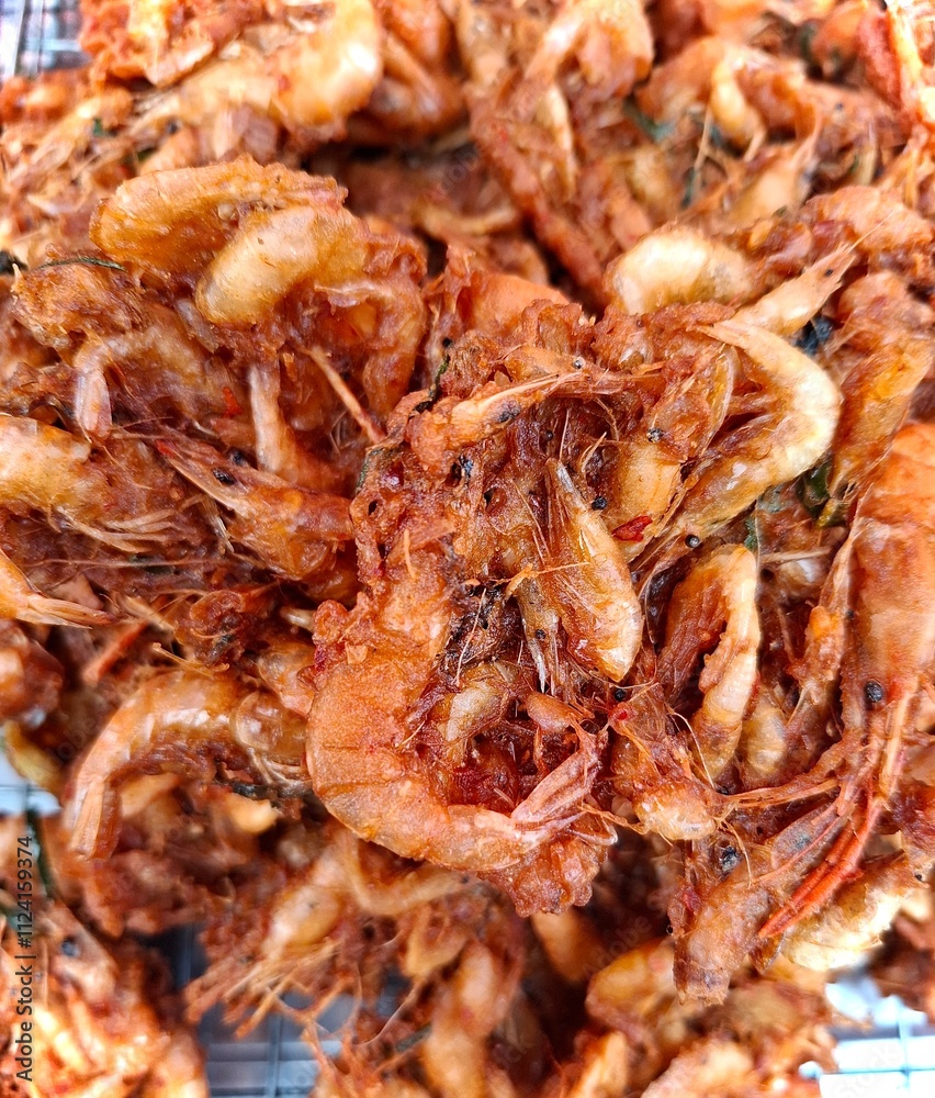Small river prawns coated in crispy batter, a delicious Thai delicacy. Small river prawns coated in crispy batter, a delicious Thai delicacy.