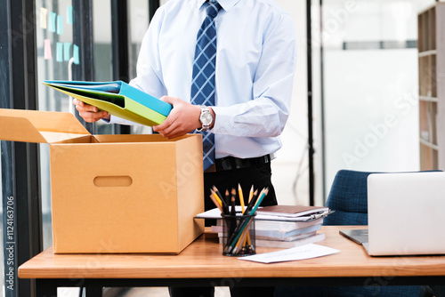 Employee packing belongings into a box during a job change or resignation