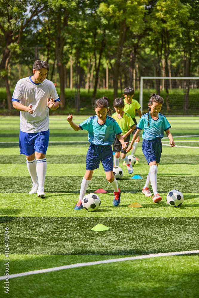 Chinese Coach and Kids in Football Training Class Chinese Coach and Kids in Football Training Class