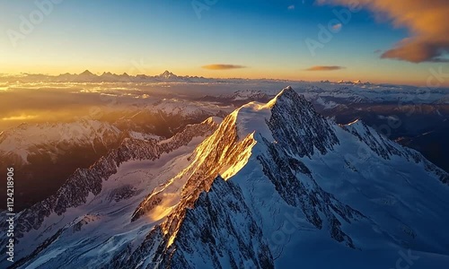 Majestic snow-capped mountain at sunset