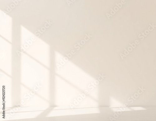 Sunlit room with clean white walls and soft shadows, ideal for minimalist interiors and modern design