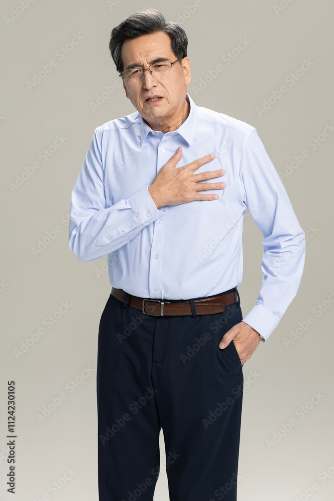 Male entrepreneur having a heart attack Male entrepreneur having a heart attack
