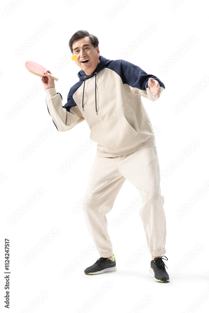 Happy senior Chinese man playing table tennis Happy senior Chinese man playing table tennis