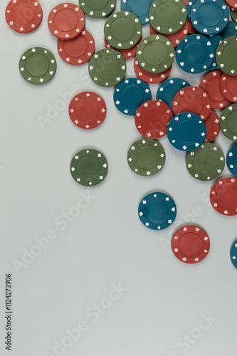 Top view of poker chips on grey background. Lot of gambling chips. Board game, playing cards, poker, casino. Copy space, flat lay.