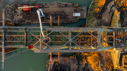 Aerial view on worker as they cutting waste metal of bridge by mixing oxygen and acetylene gas, propane