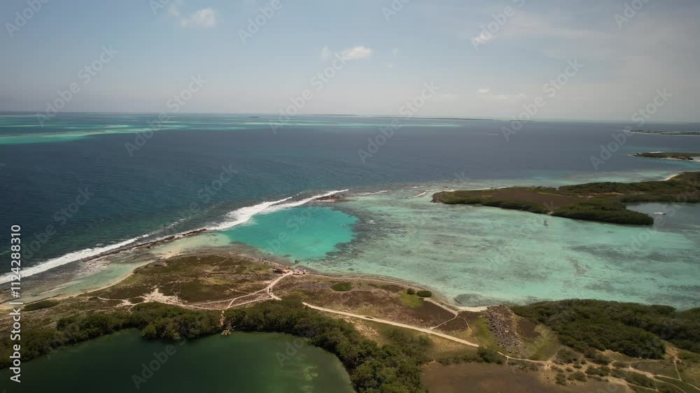 Franisky island with turquoise waters and sandy coastline on a sunny day, aerial view Franisky island with turquoise waters and sandy coastline on a sunny day, aerial view