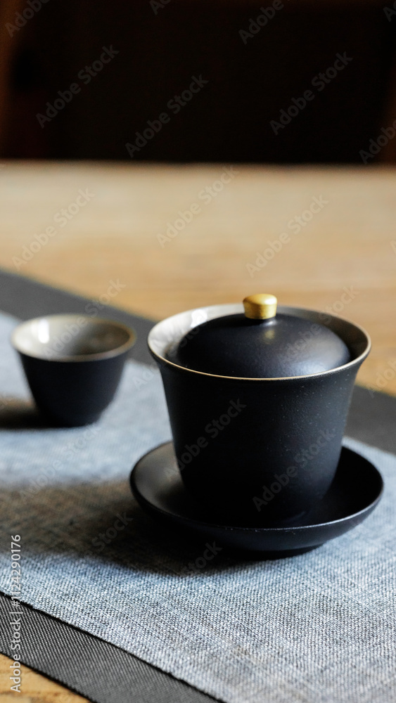 An Elegant Black Tea Set Displayed on a Minimalist Dining Table, Perfect for Afternoon Tea An Elegant Black Tea Set Displayed on a Minimalist Dining Table, Perfect for Afternoon Tea
