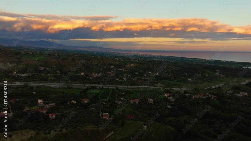 Landscape In Calabria In Italy With Sunrise Sky And Colorful Clouds Landscape In Calabria In Italy With Sunrise Sky And Colorful Clouds