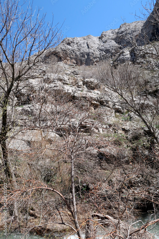 Mountains stones, hills, green meadows, spring landscape Mountains stones, hills, green meadows, spring landscape