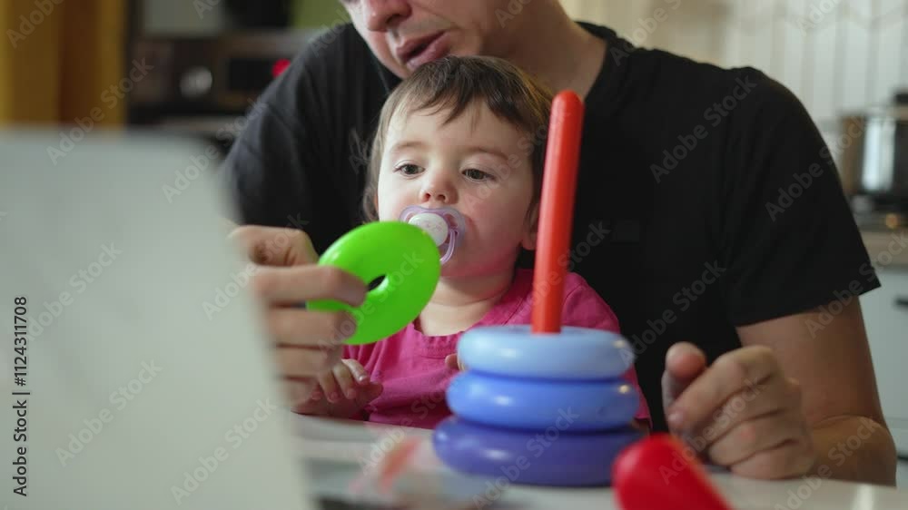 Father child sit together at table with laptop harmoniously combining play work. Family moments filled with work play communication on tasks. Play and work overlap as father child share learning fun. Father child sit together at table with laptop harmoniously combining play work. Family moments filled with work play communication on tasks. Play and work overlap as father child share learning fun.