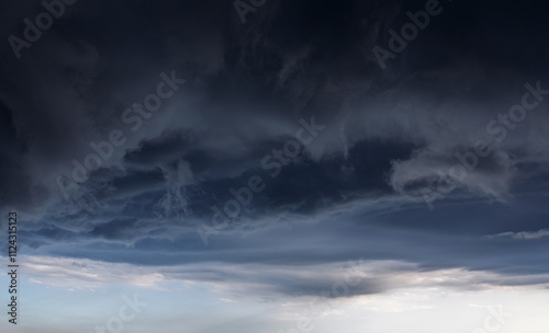 Dramatic blue sky with white clouds.