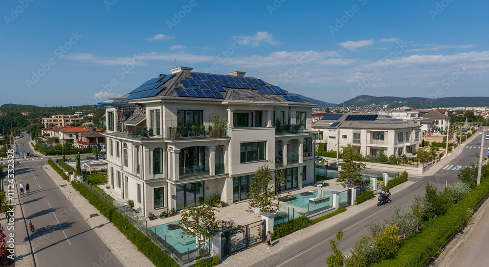 Obraz premium Real estate home with powered solar panels roof 