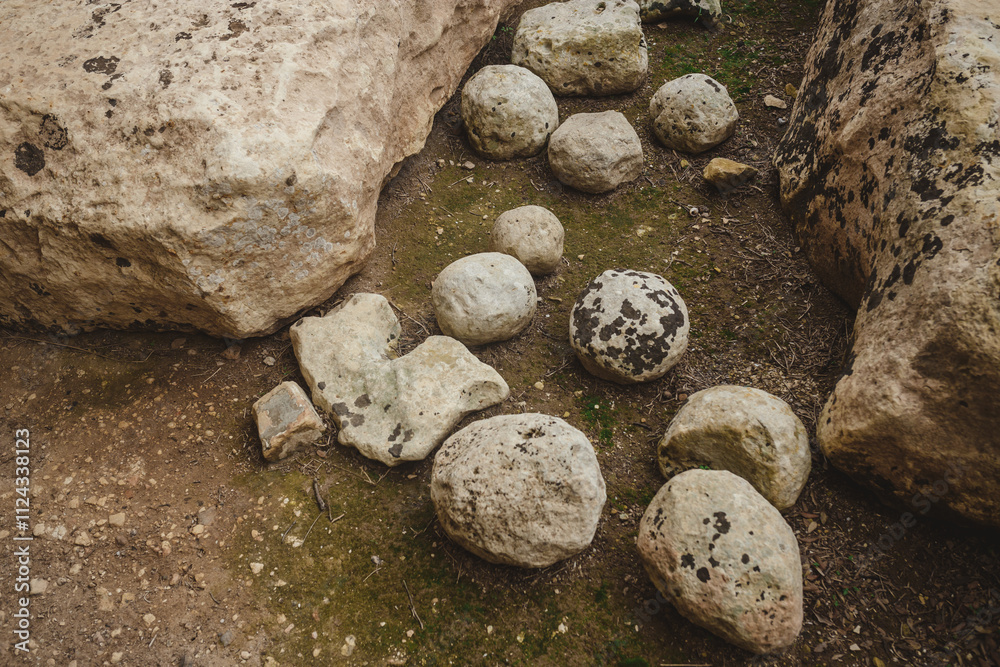 A group of large, round stones on the ground A group of large, round stones on the ground