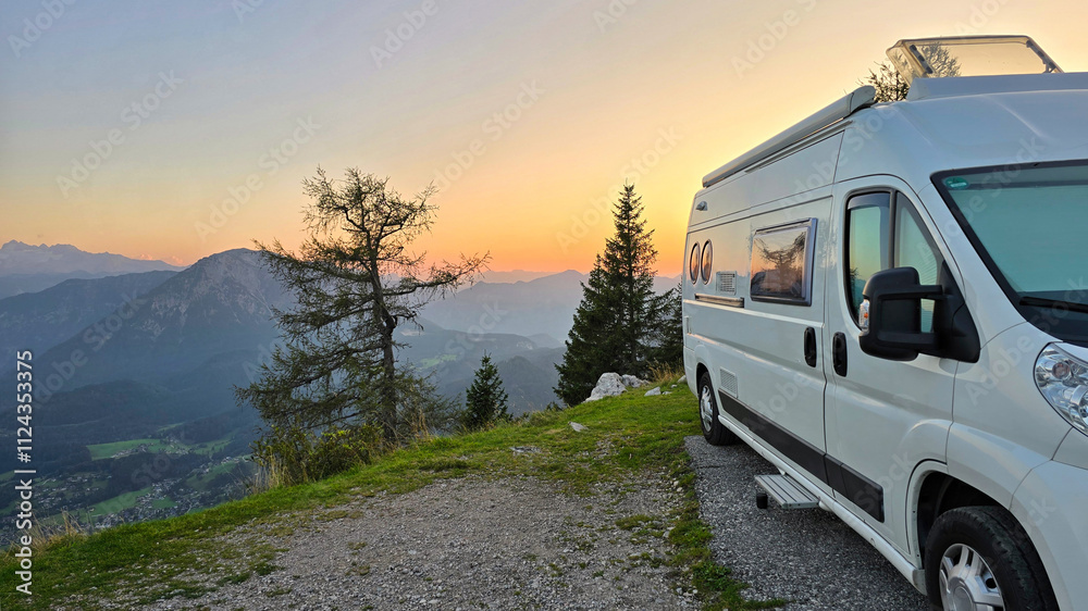 Awake to the soft light of dawn illuminating the majestic mountains surrounding Hallstatt, Austria. Relaxing from a cozy camper van, the landscape unfolds with stunning natural beauty at sunsrise Awake to the soft light of dawn illuminating the majestic mountains surrounding Hallstatt, Austria. Relaxing from a cozy camper van, the landscape unfolds with stunning natural beauty at sunsrise