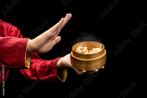 Tableau sur toile Chinese person showing dim sum dumpling on bamboo wooden basket bowl