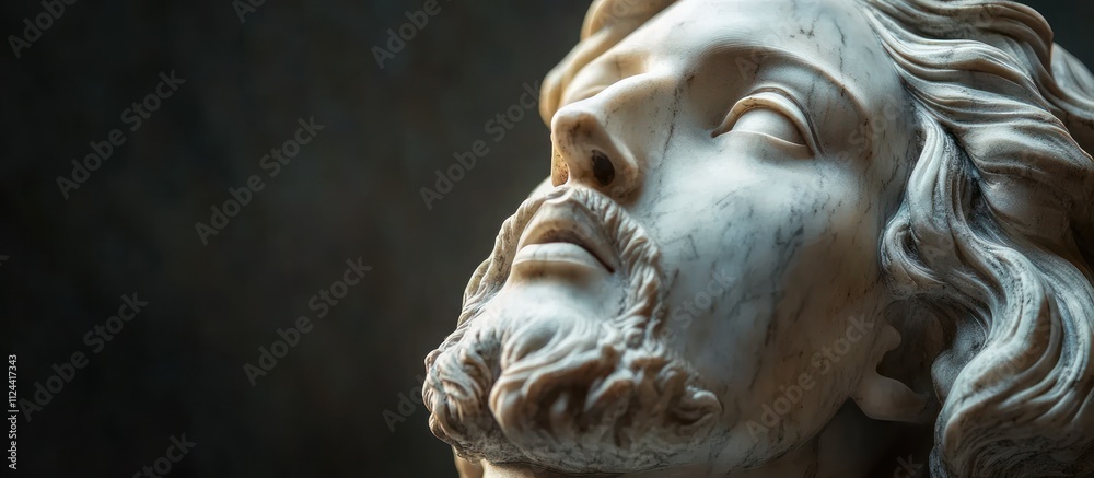 Close-up of Classical Jesus Christ Sculpture Head in Dramatic Chiaroscuro Lighting Close-up of Classical Jesus Christ Sculpture Head in Dramatic Chiaroscuro Lighting
