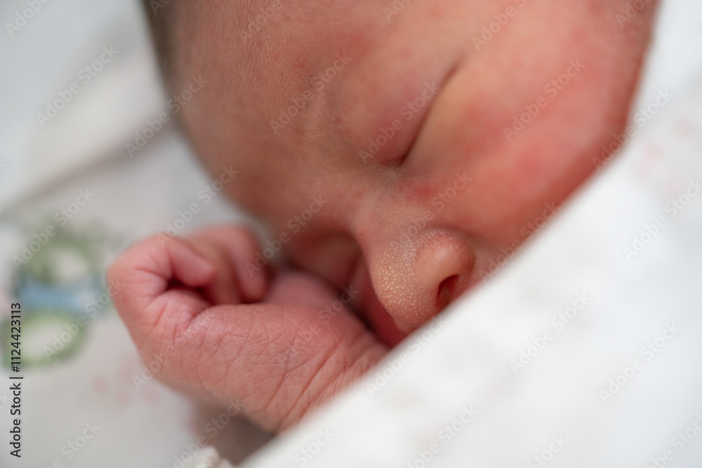 Newborn baby peacefully sleeping with small feet and adorable face Newborn baby peacefully sleeping with small feet and adorable face