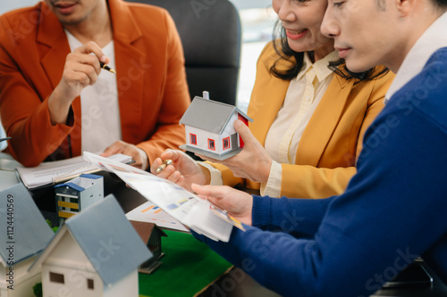 Asian Customers who choose to buy a condominium room and a bank approve a loan for their purchase.