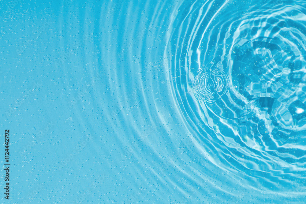 drops on water with circles on a blue background drops on water with circles on a blue background