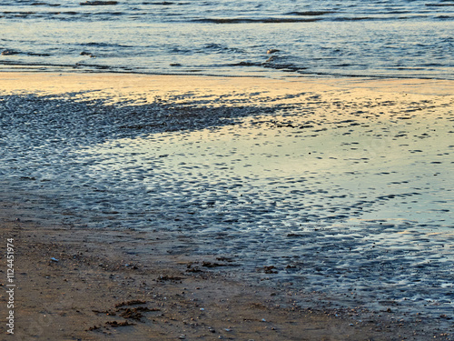 Sanlúcar de Barrameda beach. Opposite is the Doñana National Park. Sunset and fishing boats.