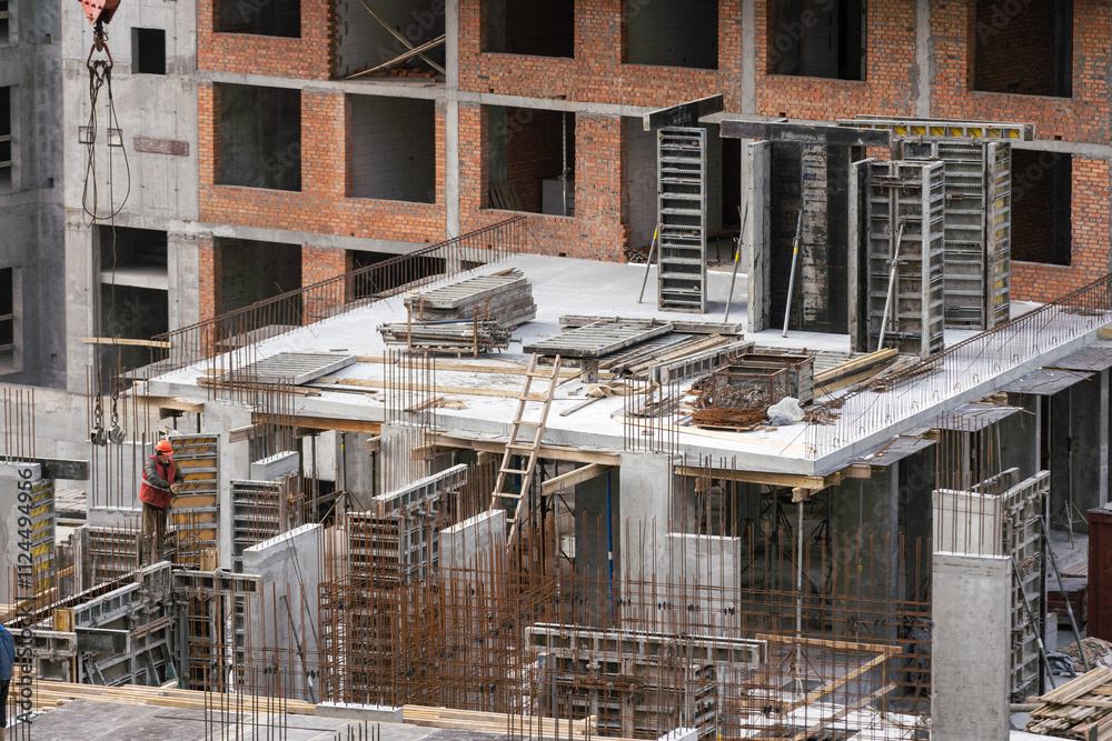 Construction Crane at Building Site - Concept of Modern Construction Construction Crane at Building Site - Concept of Modern Construction