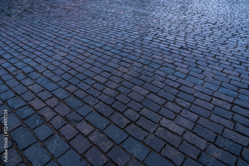 Paving stones. Stone pavement texture. Cobblestones on Red Square in Moscow. Perspective.