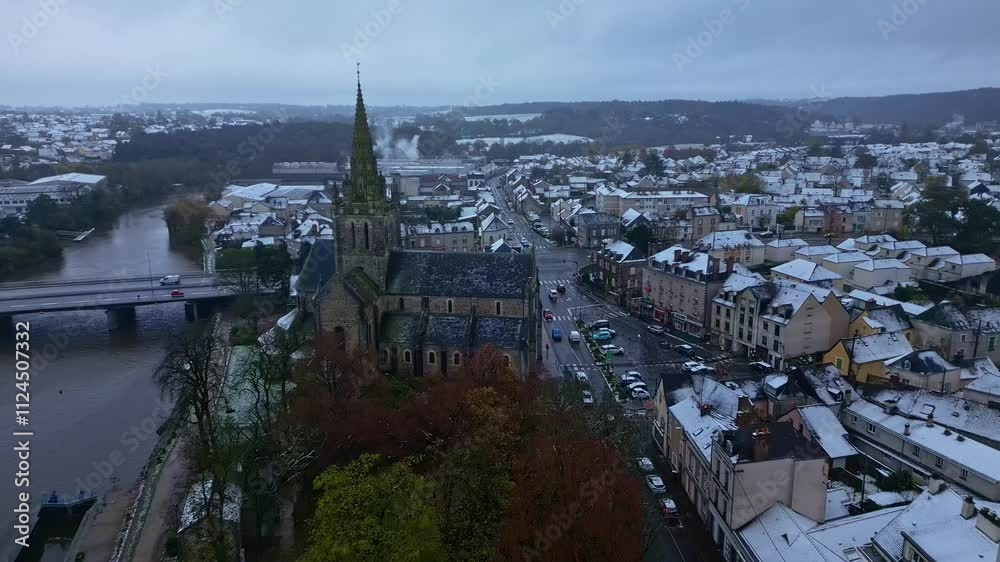 Backward drone movement from the Notre-Dame Basilica of Avesnières in winter, Laval, Mayenne, France.