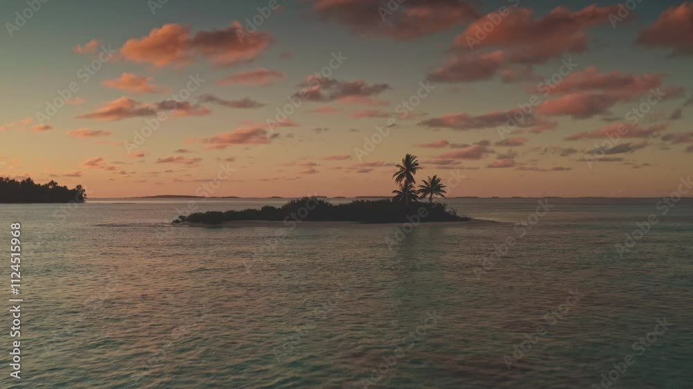 Breathtaking aerial view of small island in Tikehau atoll, French Polynesia, vibrant colorful sunset sky, palm trees and tranquil turquoise waters. Remote wild nature paradise, exotic summer travel Breathtaking aerial view of small island in Tikehau atoll, French Polynesia, vibrant colorful sunset sky, palm trees and tranquil turquoise waters. Remote wild nature paradise, exotic summer travel