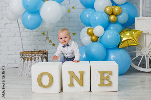 Adorable One-Year-Old Boy Celebrating First Birthday in Blue Decor