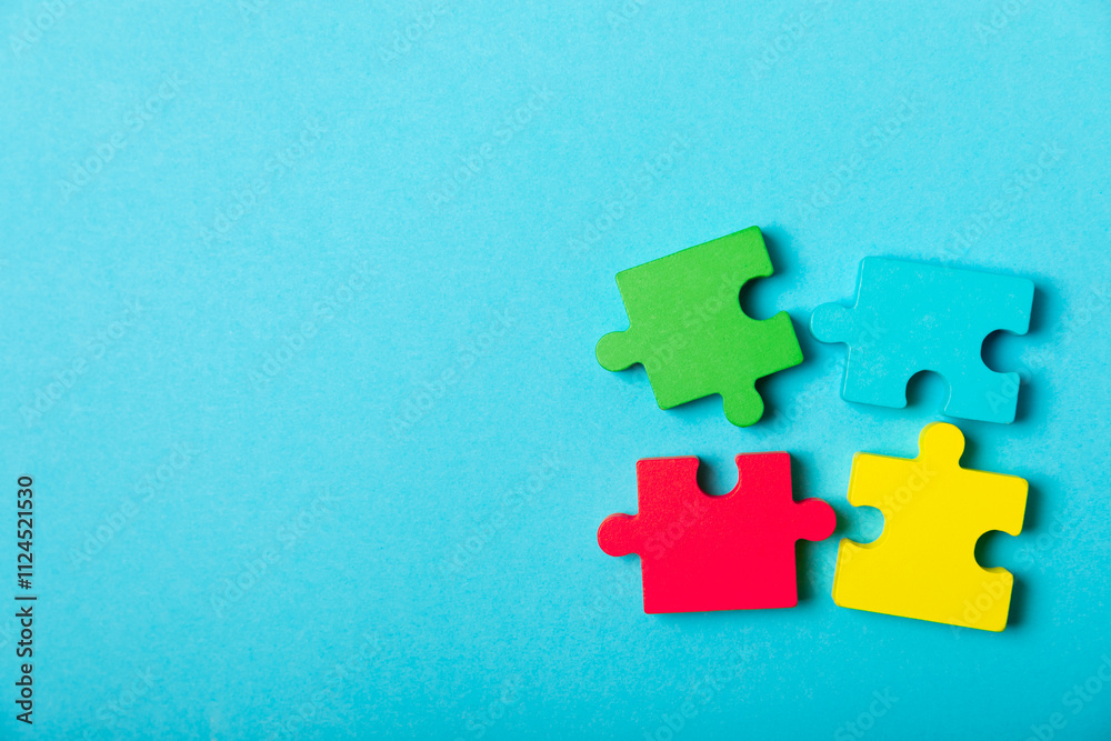 Obraz premium Autism puzzle.Autism awareness day. Colorful bright puzzles.Puzzle. 2 April world autism awareness day background. Top view. Space for text.Copy space.Design element.Care Awareness campaign for Autism