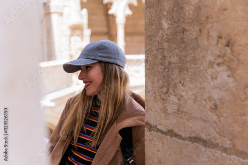 Smiling woman sightseeing through the european streets. #1124526350