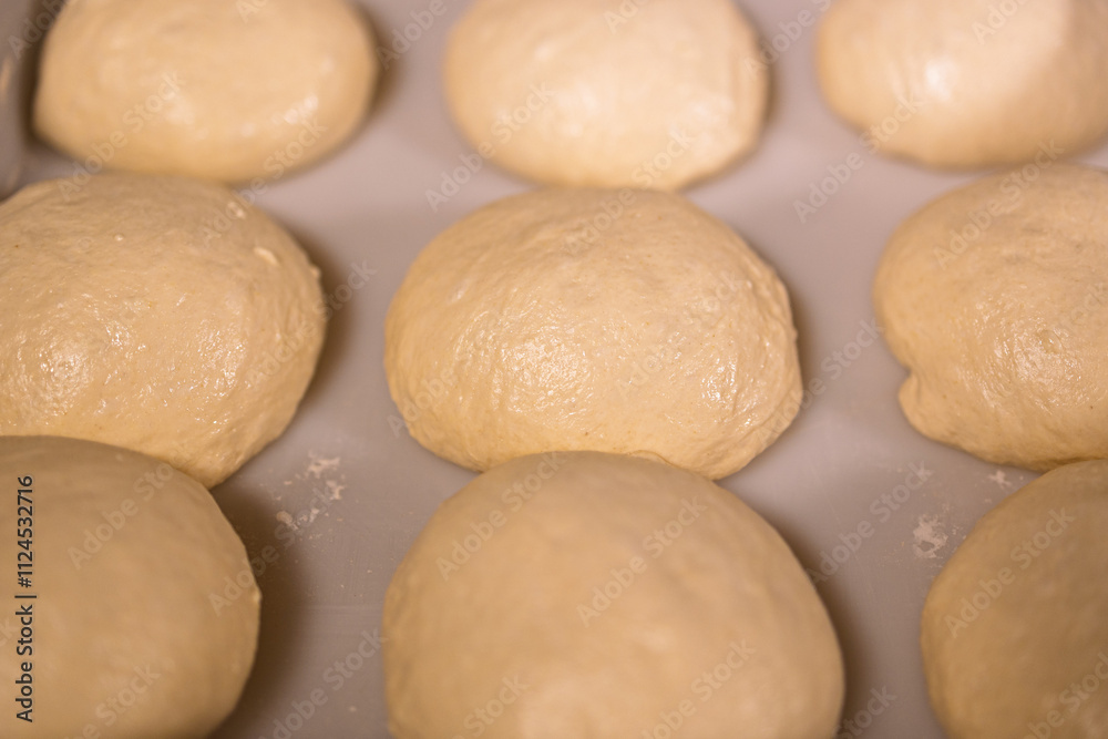 round buns made of white flour dough, baking preparation round buns made of white flour dough, baking preparation