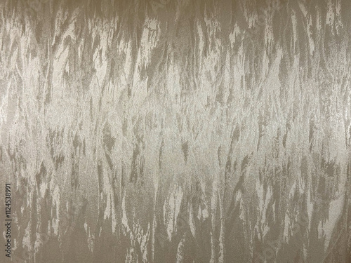 Close up of glossy synthetic beige fabric in random vertical stripes brushed pattern. Pale brass gold beige fabric seamless background texture. 