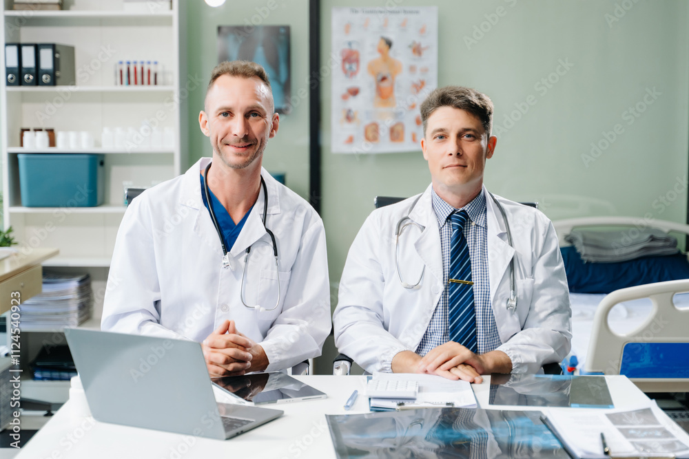 Doctors analyzing an X-ray, collaborating with digital tools in a medical office. Showcasing teamwork, diagnostic Doctors analyzing an X-ray, collaborating with digital tools in a medical office. Showcasing teamwork, diagnostic