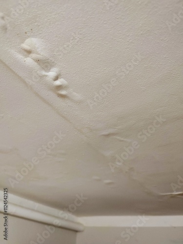 Close-up of ceiling with water damage

