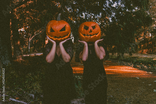 pumpkin head costume in the forest photo