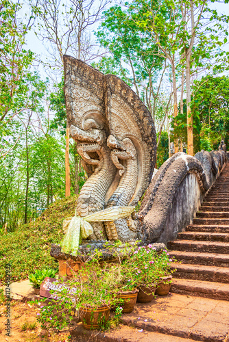 Nagas at the base of the staircase of Phrathat Pukhaw temple complex, Ban Sop Ruak, Thailand photo