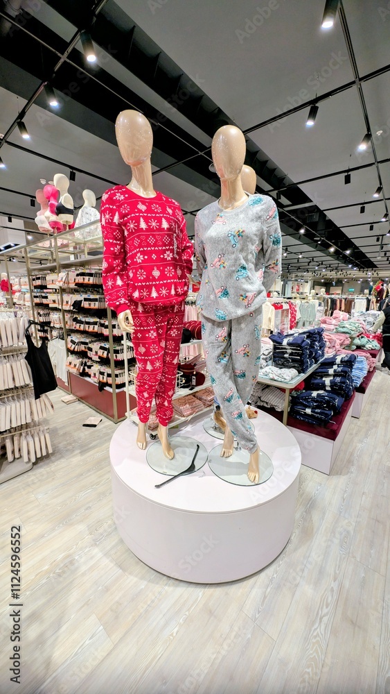 Plastic mannequin wearing colourful clothing style at Dunnes stores, fashion and clothing shop interior