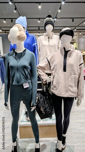 Plastic mannequin wearing colourful clothing style at Dunnes stores, fashion and clothing shop interior