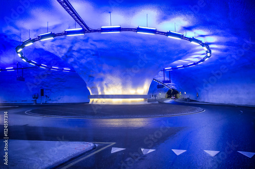 Kinsarvik Tunnel with a futuristic blue-lit traffic circle in Norway