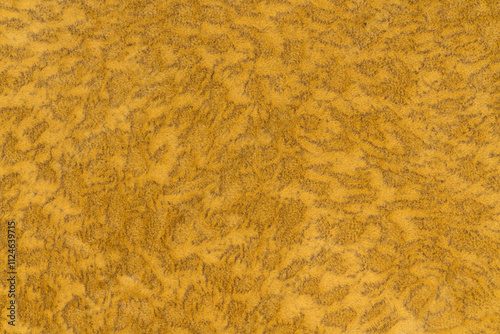 Yellow color velvet or velour with short haired fluffy and soft texture background. Close-up yellow colour surface level textile material, colored background fabric texture, free copy space for design photo