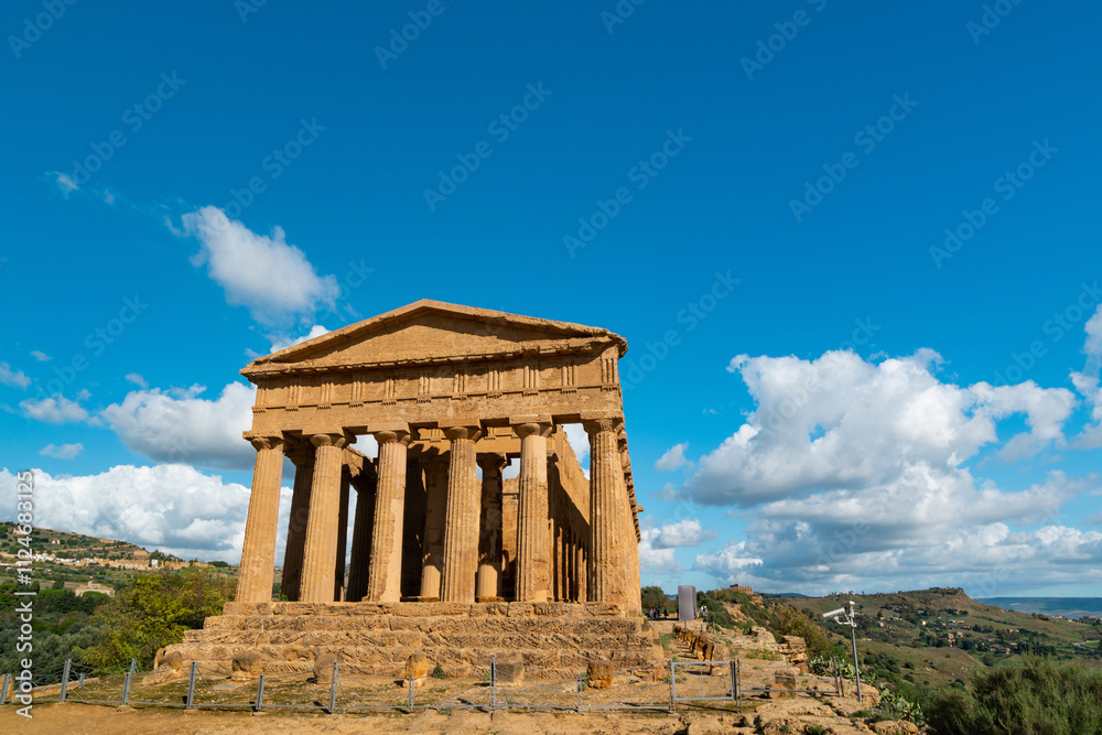 Fototapeta premium Ancient Greek Temple Ruins in Sicily, Italy Under Blue Sky