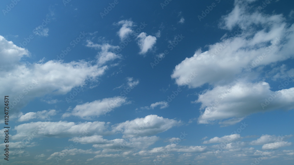 Blue sky in tropical summer or spring sunlight. Blue sky background with tiny stratocumulus cumulus clouds. Timelapse. Blue sky in tropical summer or spring sunlight. Blue sky background with tiny stratocumulus cumulus clouds. Timelapse.