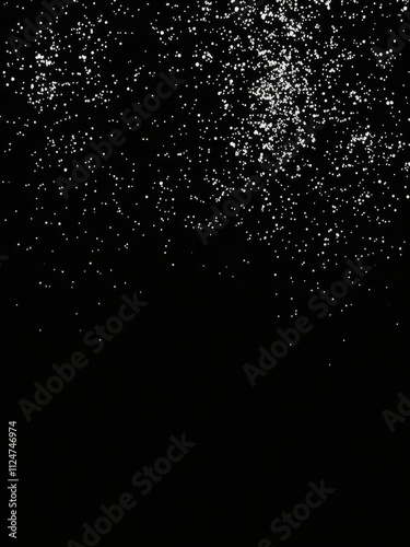 Shiny silver glitter on elegant black background creating a luxurious and sparkly effect, background