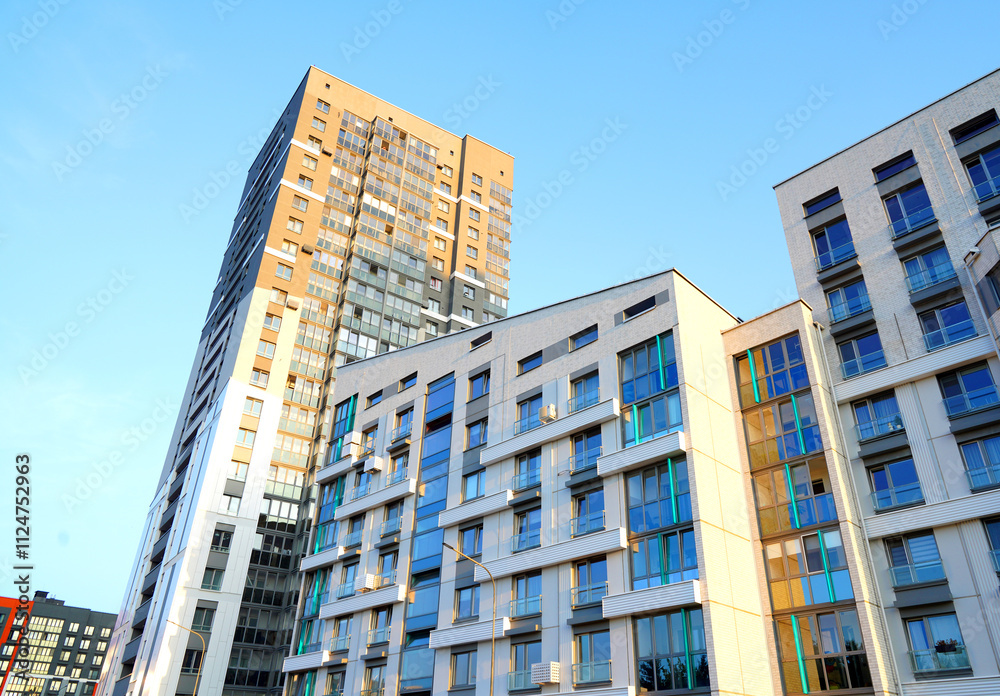 Fototapeta premium Residential condominium building. Modern complex of Apartment residential condo. Residential architecture exterior. Modern facade building. New House, Eco-friendly residential building.