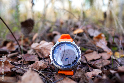 Wallpaper Mural Smartwatch on autumn background. Sports watch for travel. Expedition smartwatch. Watch for survival in wildlife. Outdoor, hiking Watch on hand. GPS track Smartwatch. Watch for adventure, traveling. Torontodigital.ca