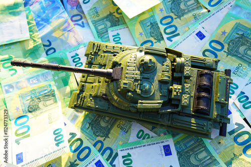 Tank on background of banknotes. Currency war. War costs, military spending. Making money from war. Money laundering on War. Military economy. Military tank and European banknotes. Weapons trade. photo