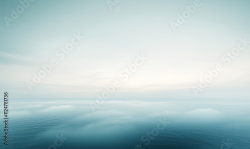 Serene ocean horizon with soft clouds