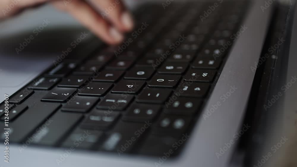 Unrecognizable woman working on a laptop close-up. Symbolizes technology, business and work in the digital world. The concept of modern work and progress. Unrecognizable woman working on a laptop close-up. Symbolizes technology, business and work in the digital world. The concept of modern work and progress.