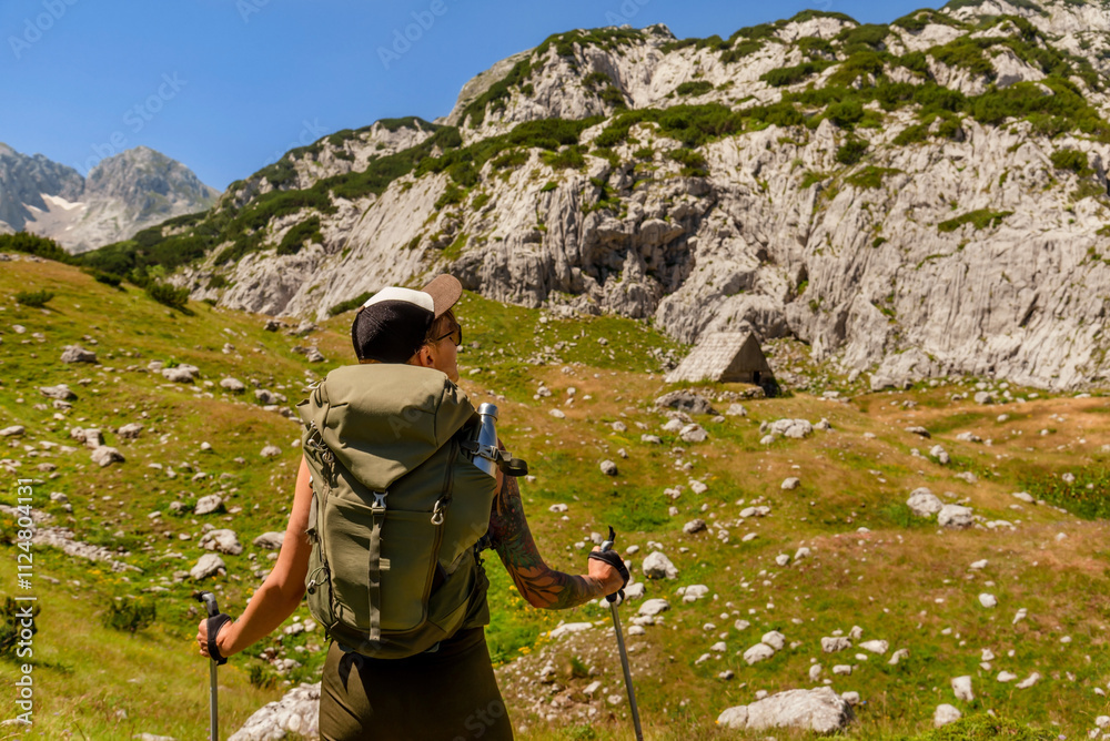 Young Woman Walking Alone in Mountain Path